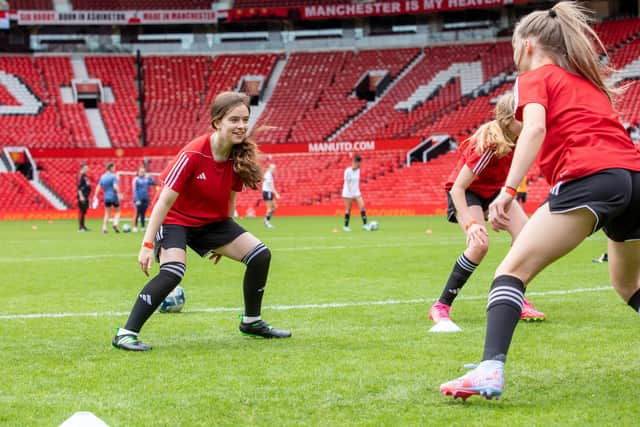 Taking part in a training session at the 'Theatre of Dreams'.