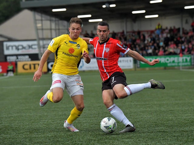Derry City’s Michael Duffy holds off a tackle from KuP’s Seth Saarinen. Photo: George Sweeney. DER2330GS -