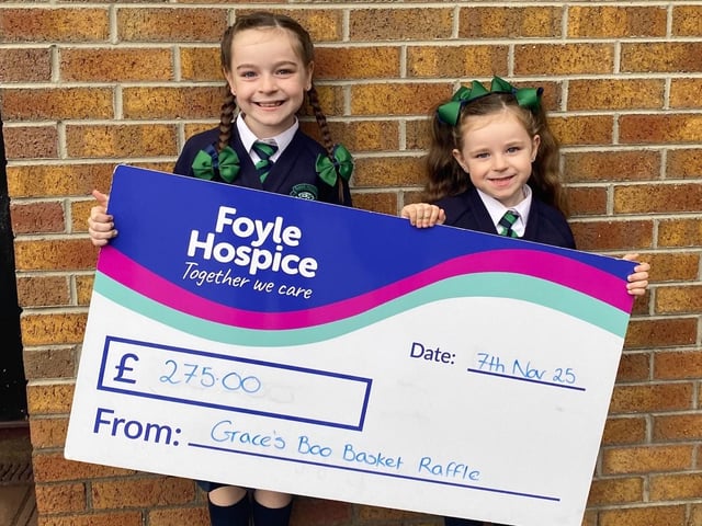 Grace Smith, who raised a brilliant £275 in support of Foyle Hospice, proceeds from her very own 'Boo Basket' Raffle! Grace (left) is pictured with her proud sister presenting a cheque to Foyle Hospice.