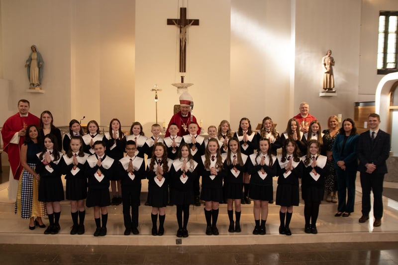 Pupils from Mr. Gallagher's P7 class at Holy Child Primary School who received the Sacrament of Confirmation from Bishop Donal McKeown at St. Mary's Church, Creggan on Friday last. Included in photo is Fr. Ignacio, Fr. McFaul, Mrs. Pat Concannon, Principal, Ms. Sarah Oelve, Ms. Joanne Logue, Mrs. Aine O'Connor, Vice Principal.(Photos: Jim McCafferty Photography)