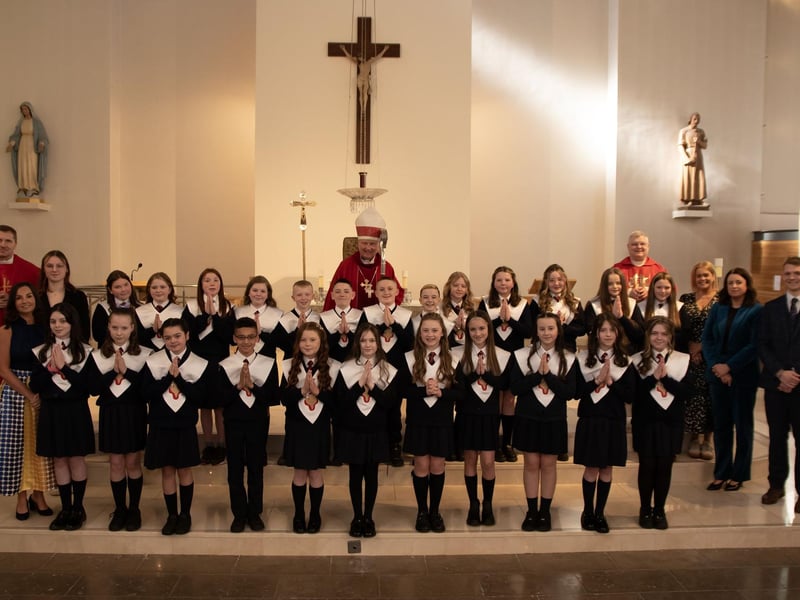 Pupils from Mr. Gallagher's P7 class at Holy Child Primary School who received the Sacrament of Confirmation from Bishop Donal McKeown at St. Mary's Church, Creggan on Friday last. Included in photo is Fr. Ignacio, Fr. McFaul, Mrs. Pat Concannon, Principal, Ms. Sarah Oelve, Ms. Joanne Logue, Mrs. Aine O'Connor, Vice Principal.(Photos: Jim McCafferty Photography)