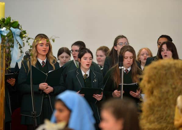Students from St Cecilia’s College choir take part in a Carol Service held in St Mary’s Church, Creggan, on Tuesday afternoon. Photo: George Sweeney. DER2251GS – 01