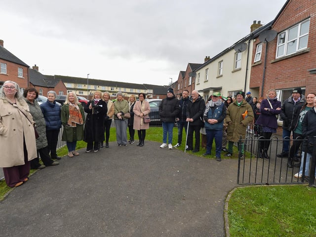 Some of the family, neighbours and friends who attended the unveiling of a bench, in Culdaff Gardens, Creggan, in memory of Annette McDaid. Photo: George Sweeney
