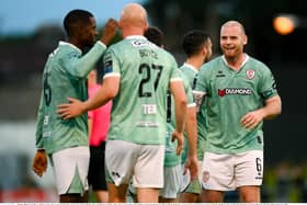 Liam Boyce of Derry City, 27, is congratulated by team-mates Sadou Diallo, left, and Mark Connolly, right, after scoring their side's third goal during the Sports Direct Men’s FAI Cup second round match between Treaty United and Derry City at Markets Field in Limerick. Photo by Stephen McCarthy/Sportsfile