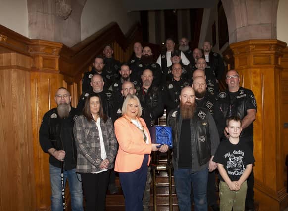 OUTLAWS BIKERS HONOURED. . . . .The Mayor of Derry City and Strabane District Council, Sandra Duffy making a presentation to Kevin Kelly and The Outlaws Motorcycle Club at the Guildhall on Friday night in recognition of the club’s charity work in the city and district.:.