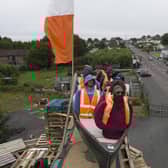 MOYGASHEL, JULY 10: A model of a small boat with several figures depicting migrants inside can be seen on top of a loyalist bonfire on July 10, 2025 in Moygashel. Loyalists have constructed a bonfire effigy depicting a boat full of migrants with mannequins wearing lifejackets and placards reading "Stop the boats," and "Veterans before refugees." The effigy was burned atop a pyre of pallets on Thursday night. Moygashel Bonfire Committee has said that the bonfire "topper" should not be seen as "racist, threatening or offensive" and it was "expressing our disgust at the ongoing crisis that is illegal immigration". (Photo by Charles McQuillan/Getty Images)