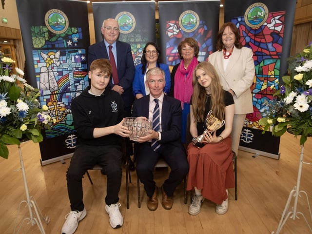 James Tourish receiving the The John McDaid Memorial Prize & Derry Charismatic Prize from Mr. Niall Downey, guest speaker, at Thursday's St. Columb's College Prizegiving. At front is Miss. J. Donohue, James' guest. Included at back are Mr. P. Kelly, board of governors, Mrs. C. McLaughlin, Principal, Ms. M. Hamilton and Mrs. G. Canavan, board of governors.