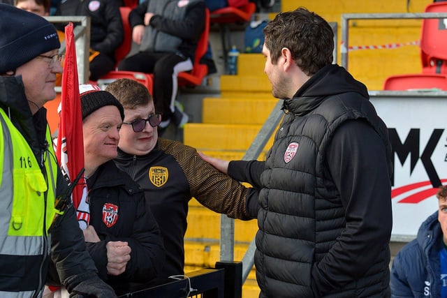 Derry City Ruaidhrí Higgins greets fans at the game against Finn Harps. Photo: George Sweeney. DER2305GS – 21