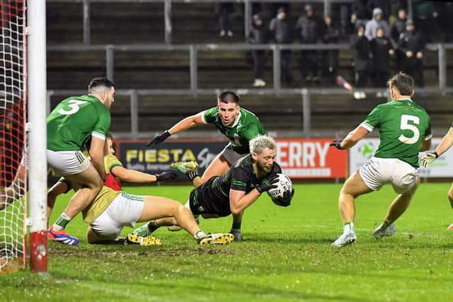 Newbridge players converge on Glen’s Ryan Dougan. Photo: George Sweeney