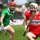 Cormac O'Doherty of Derry shields the sloithar from London's Robbie Murphy . Photo: George Sweeney