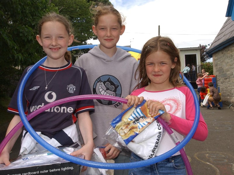 From left, Kadie Mellon, Ciara Mellon, and Megham McKeever with some of the prizes they won at Culmore Primary School fun day. (2406PG104)                               