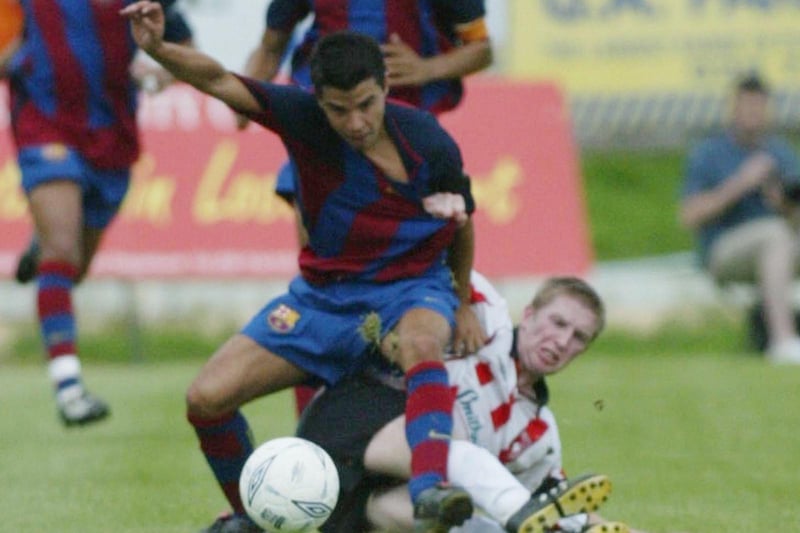 Derry City captain Eamon Doherty and Barcelona forward Saviola battle for possession.  (1508JB15)