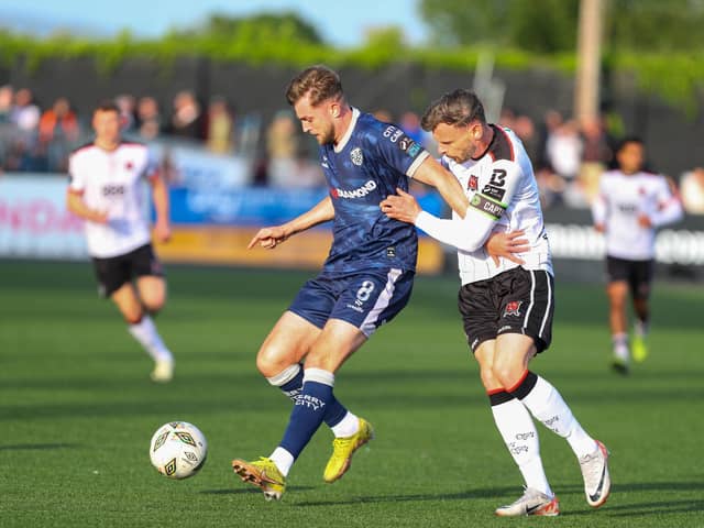 Will Patching holds off his man at Oriel Park during Derry's scoreless draw against Dundalk. Photograph by Kevin Moore.