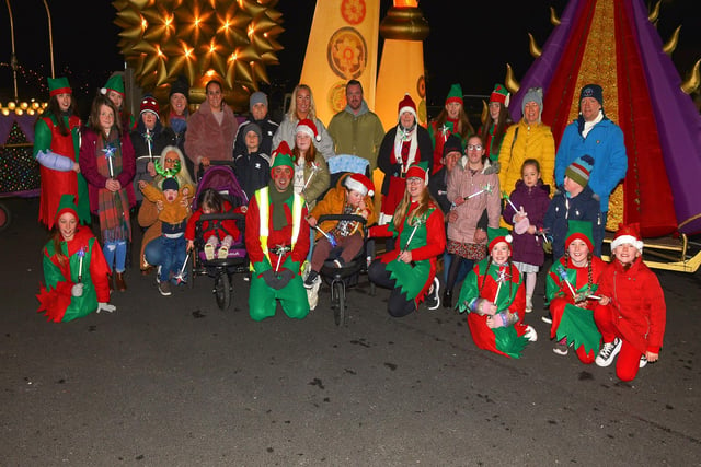 Children and parents from the Foyle Down Syndrome Trust pictured with Santa’s Elves at the Derry Christmas Lights parade. Photo: George Sweeney.  DER2147GS – 009