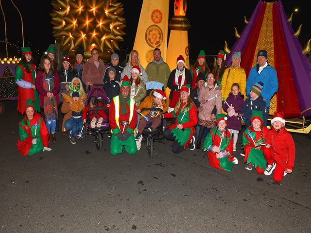 Children and parents from the Foyle Down Syndrome Trust pictured with Santa’s Elves at the Derry Christmas Lights parade. Photo: George Sweeney. DER2147GS – 009
