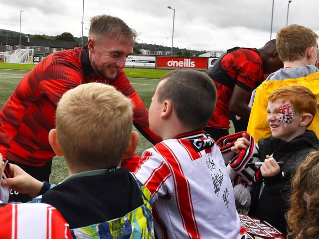 Carl Winchester greets fans at the Derry City open training session on Monday morning in  Brandywell Stadium. The event was organised at part of the Gasyard Feile.  Photo: George Sweeney / Derry Journal