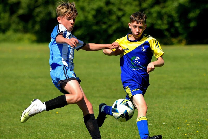 Eglinton Eagles and StrabaneAthletic in action during the D&D U12 Championship Summer Cup final at Prehen on Sunday morning last. Photo: George Sweeney. DER2322GS - 41