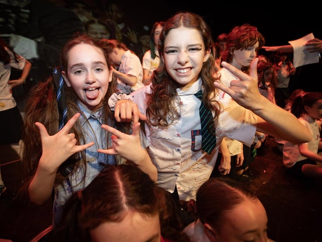 Tara Breslin Dean and Ruby Cirtma rock it out on stage as part of School of Rock cast!