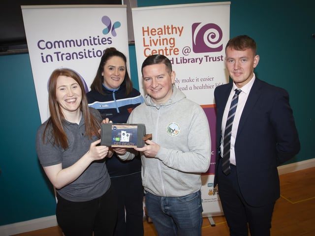 Julie White, OLT, pictured handing over a gift pack to Collie Kelly who took part in Saturday’s Men’s Health Day event at the Creggan Centre. Included is Aisling Hutton, Bogside, Brandywell Health Forum and Padraig Delargy, Sinn Fein.
