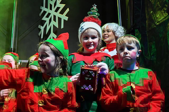 Pupils from Culmore Youth Club singing at the Elf Parade and Christmas Lights switch on at the Community Hub on Friday night. Photo: George Sweeney