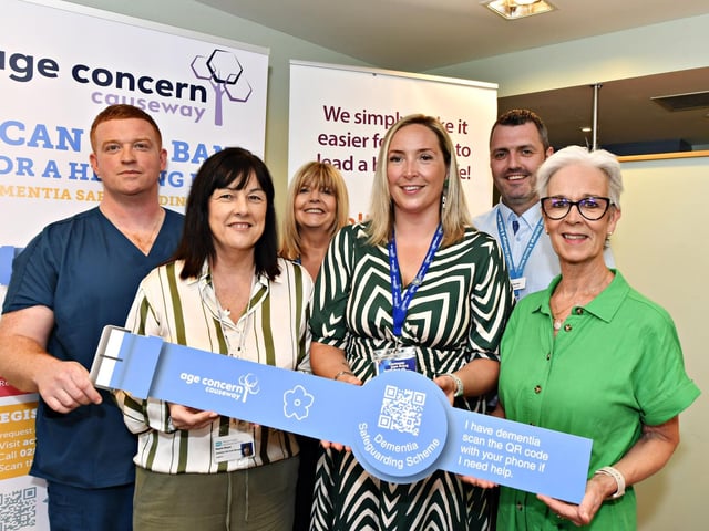 Dr Ryan Power, Bayview Medical Pracrice, Majella Magee, Western Trust, Valerie Devine, WHSCT, Mandy Corr, Age Concern Causeway, Lee Verner , Principal Social Worker, WHSCT, and the Rev Judi McGaffin at the launch of the ‘Scan the Band’ Dementia Safeguarding Scheme in the Guildhall. Photo: George Sweeney