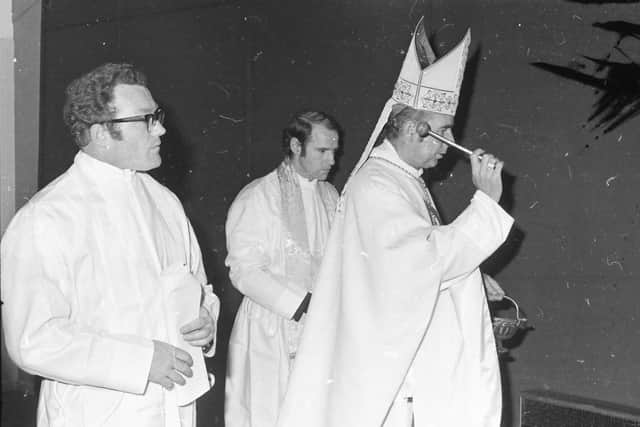 The Bishop of Derry Edward Daly consecrating St. Brigid's chapel in Carnhill in 1974, with Rev. Seamus O'Connell, Administrator, Carnhill.