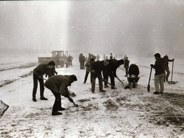 Derry City V EMFA at the Brandywell - snow clearing before the match.