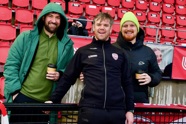 Derry City's strength and conditioning coach Kevin McCreadie shares a joke with these fans ahead of kick-off.