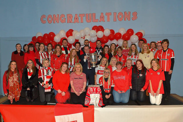 Derry City defenders Daniel Lafferty and Ciaran Coll pictured with St Eithnes Primary School staff  during a visit to the school, with the FAI Cup, on Wednesday morning. Photo: George Sweeney.  DER2246GS  082