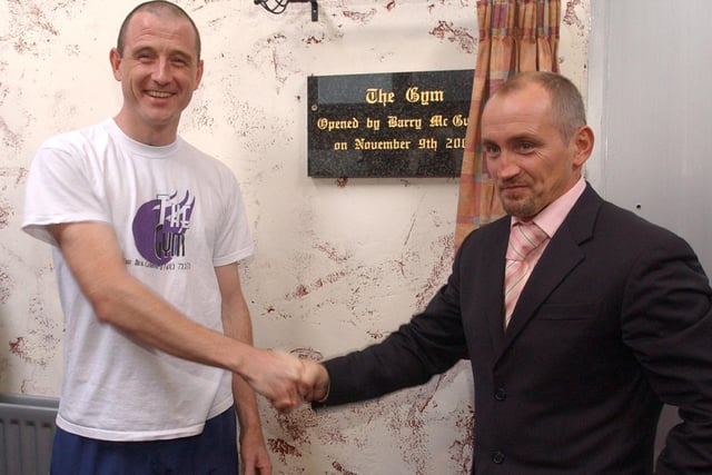 Barry McGuigan unveils the plaque during the official opening of The Gym in Carndonagh. Included is proprieter Peter Doherty. (1211PG03)