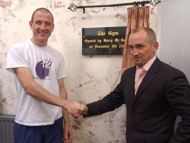 Barry McGuigan unveils the plaque during the official opening of The Gym in Carndonagh. Included is proprieter Peter Doherty. (1211PG03)