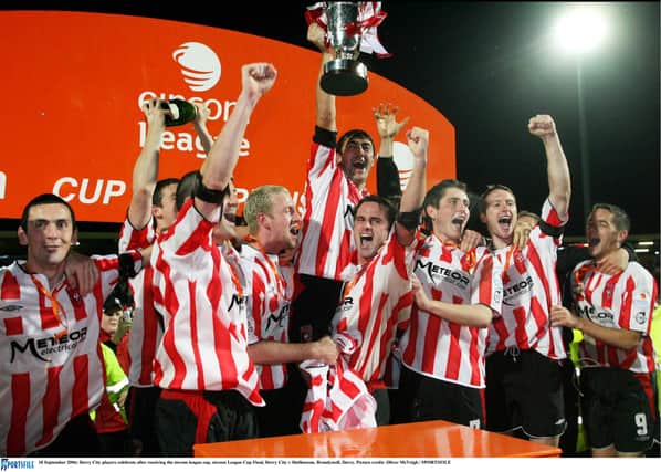 Derry City players celebrate after receiving the eircom league cup following victory over Shelbourne at Brandywell. Picture credit: Oliver McVeigh / SPORTSFILE