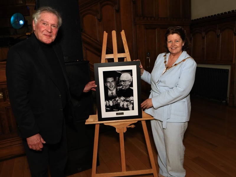 Mayor of Derry and Strabane, Councillor Patricia Logue, presents a framed photo collage of the late Derry music legend Johnny Quigley at the Live Launch Jazz Festival event, held in the Guildhall, to Joe Quigley (son). (Photo - Tom Heaney, nwpresspics)