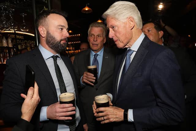 Bill Clinton having a pint of stout with Colum Eastwood in the Guildhall Taphouse.