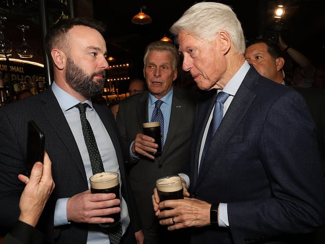 Bill Clinton having a pint of stout with Colum Eastwood in the Guildhall Taphouse.