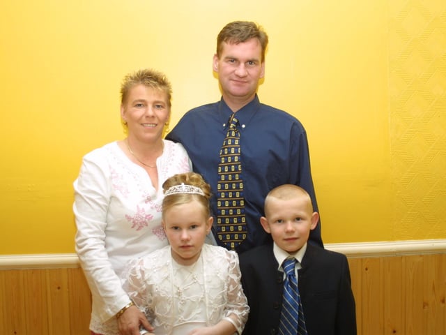 Carla pictured with her mum, dad and brother Christopher.