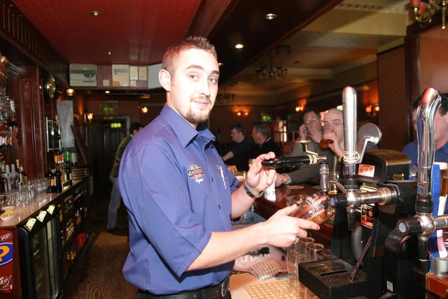 Serving drinks at The Clarendon Bar in 2004.