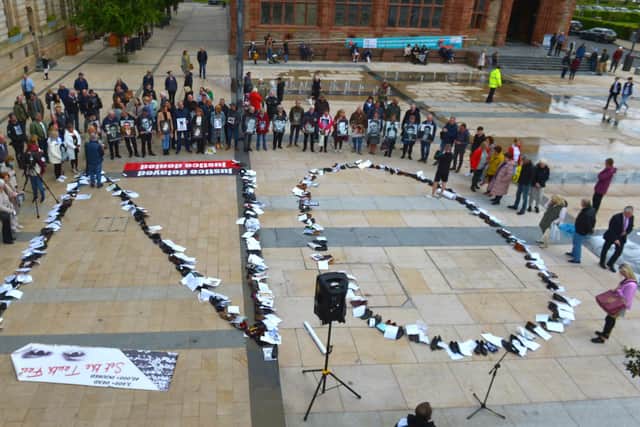 Footwear of victims of the troubles arranged to spell ‘NO’ at a protest against the proposed Northern Ireland Troubles (Legacy and Reconciliation) Bill, held in the Guildhall in 2022.  Photo: George Sweeney.  DER222GS – 015