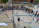 Footwear of victims of the troubles arranged to spell ‘NO’ at a protest against the proposed Northern Ireland Troubles (Legacy and Reconciliation) Bill, held in the Guildhall in 2022.  Photo: George Sweeney.  DER222GS – 015