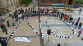Footwear of victims of the troubles arranged to spell ‘NO’ at a protest against the proposed Northern Ireland Troubles (Legacy and Reconciliation) Bill, held in the Guildhall in 2022.  Photo: George Sweeney.  DER222GS – 015