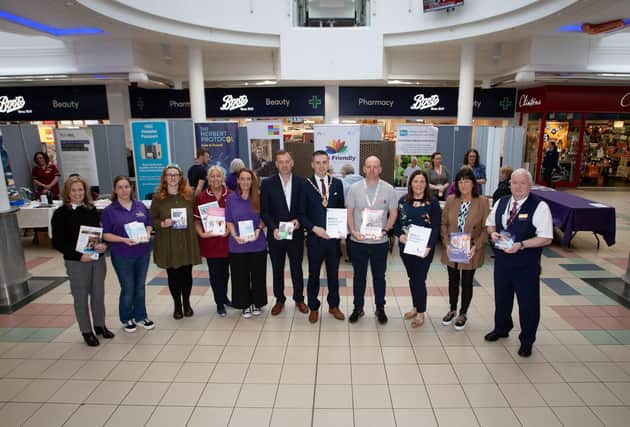 WORLD ALZHEIMER'S DAY. . . .The Deputy Mayor of Derry City and Strabane District Council, Jason Barr pictured at Thursday's DEEDS (Dementia Engaged and Empowered Derry and Strabane) 'One Stop Shop' for information on dementia at Foyleside Shopping Centre, Derry. The event, to mark World Alzheimer's Day, organised by the Old Library Trust/DEEDS and saw numerous stalls, well attended by passers-by who saw experts in line to give advice on dementia and how it affects our everyday lives. Photo includes representatives from OLT, Foyleside Shopping Centre, WHSCT and other community groups. (Photos: Jim McCafferty Photography)