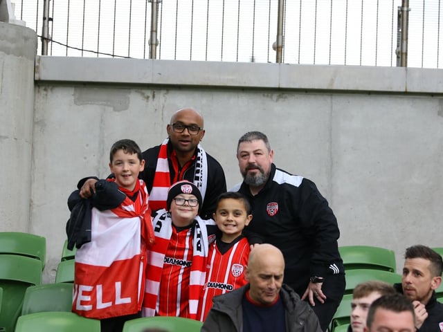 These Derry City fans take the opportunity to pose for our photographer as the atmosphere builds.