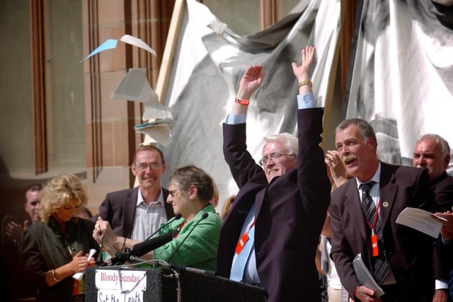 Jean Hegarty and John Kelly tear up a copy of the Widgery report after talking to the thousands of Derry people gathered for the reading of the Saville Report. (1506SL114) Photo: Stephen Latimer