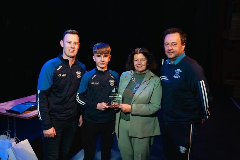 Coaches Shaun Molloy and Martin McDaid are pictured with 2011 Summer Cup winners' captain Ollie McDaid receiving a presentation from Derry City & Strabane District Council Mayor Patricia Logue. Photo: Karol McGonigle, Milkwood Studios.