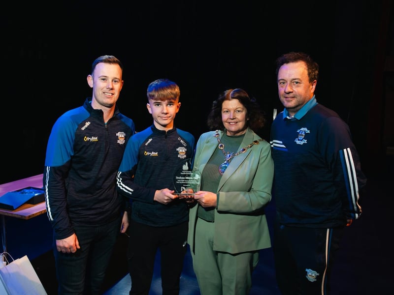 Coaches Shaun Molloy and Martin McDaid are pictured with 2011 Summer Cup winners' captain Ollie McDaid receiving a presentation from Derry City & Strabane District Council Mayor Patricia Logue. Photo: Karol McGonigle, Milkwood Studios.