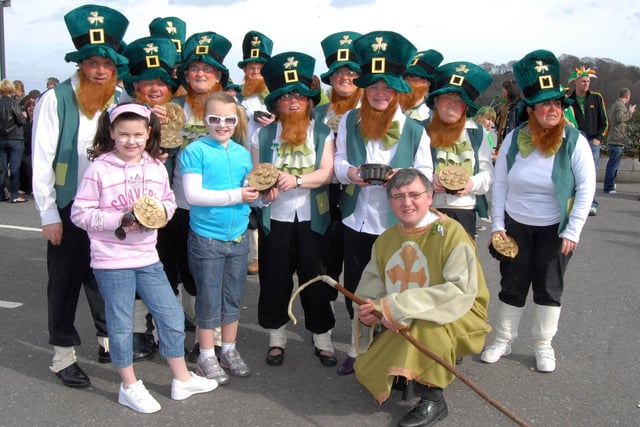 Jade Boardman and Chloe Coyle Millar pictured with the Destined leprechauns at the St Patrick's Day Parade in Derry. 1703Ap24