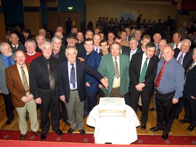 Willie John Carlin, President of Strabane FC cutting the cake at the club's 40th anniversary dance. (0402Jb08)