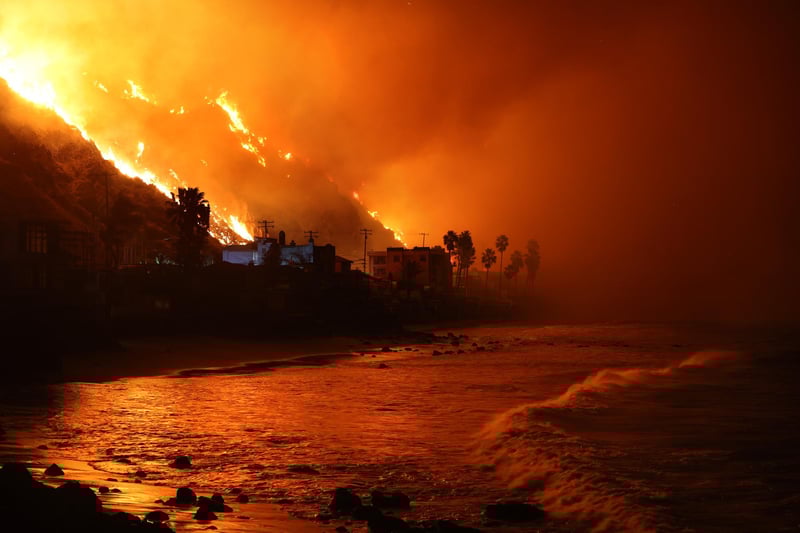 Malibu, California January 8, 2025-The Palisades Fire approaches the Pacific Ocean along PCH in Malibu Tuesday. (Wally Skalij/Los Angeles Times via Getty Images)