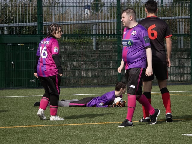 Tuned-in goalkeeper pulls of a fantastic save and takes the plaudits from the crowd.