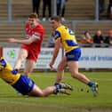 Niall Higgins and David Murray of Roscommon close in on Derry’s Lachlan Murray.  Photo: George Sweeney